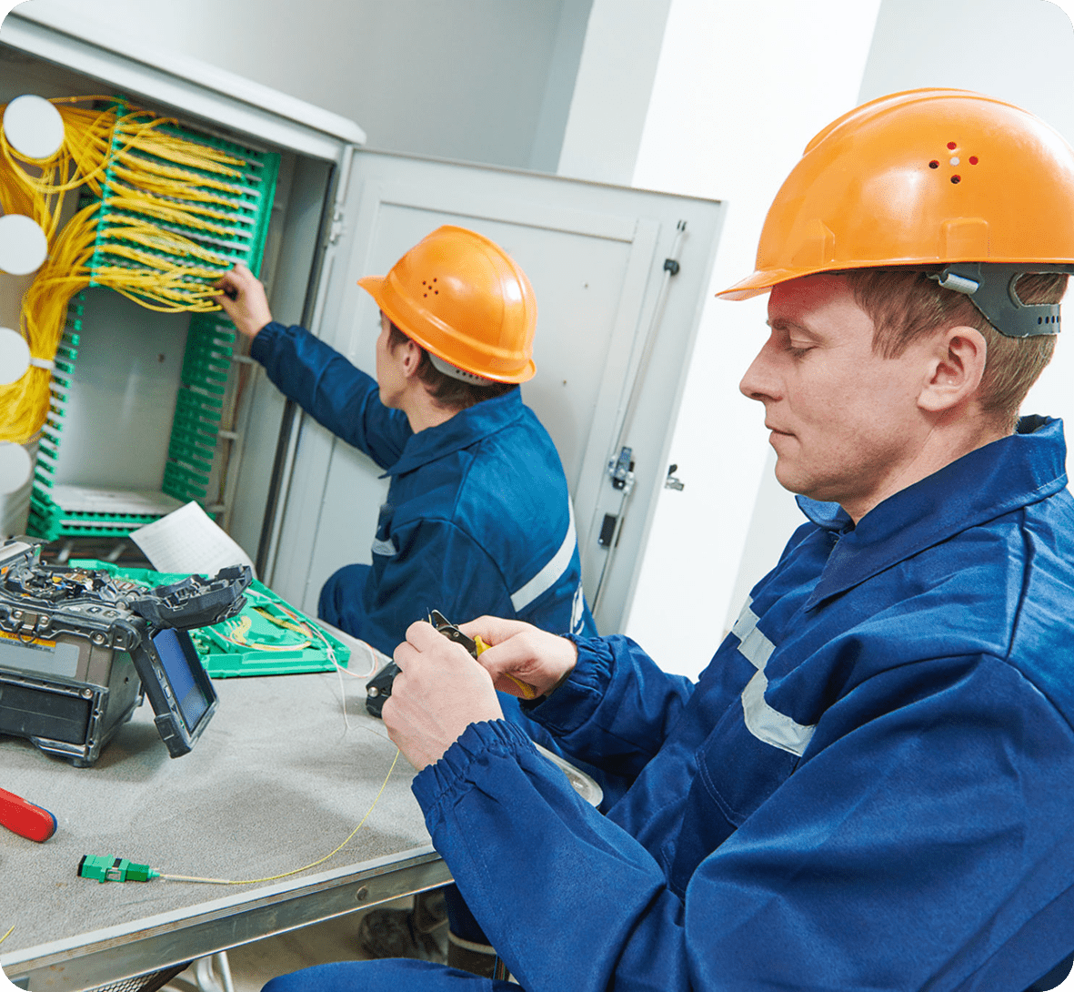 Technicians working with fiber optic cables.
